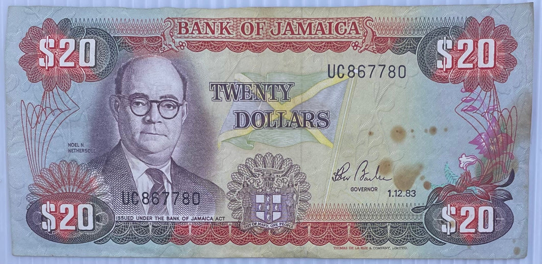 1983 Jamaica $20 Dollars banknote featuring Marcus Garvey and Dunn's River Falls in uncirculated condition
