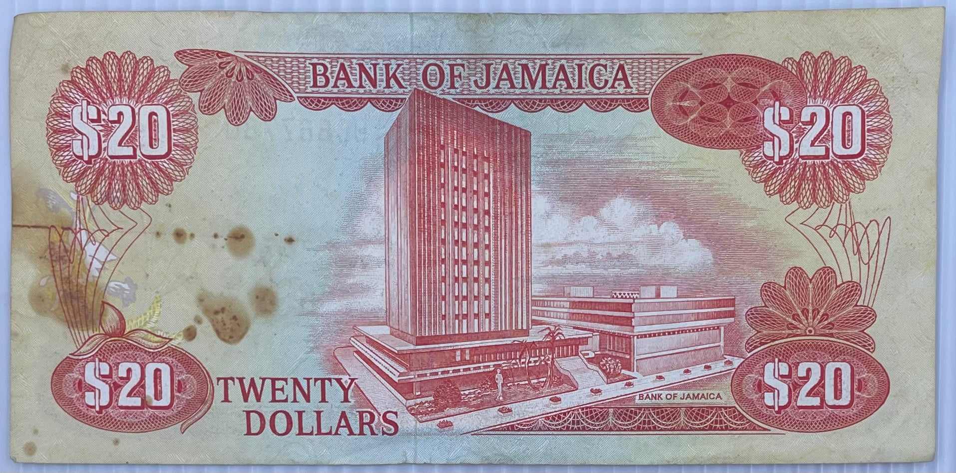1983 Jamaica $20 Dollars banknote featuring Marcus Garvey and Dunn's River Falls in uncirculated condition