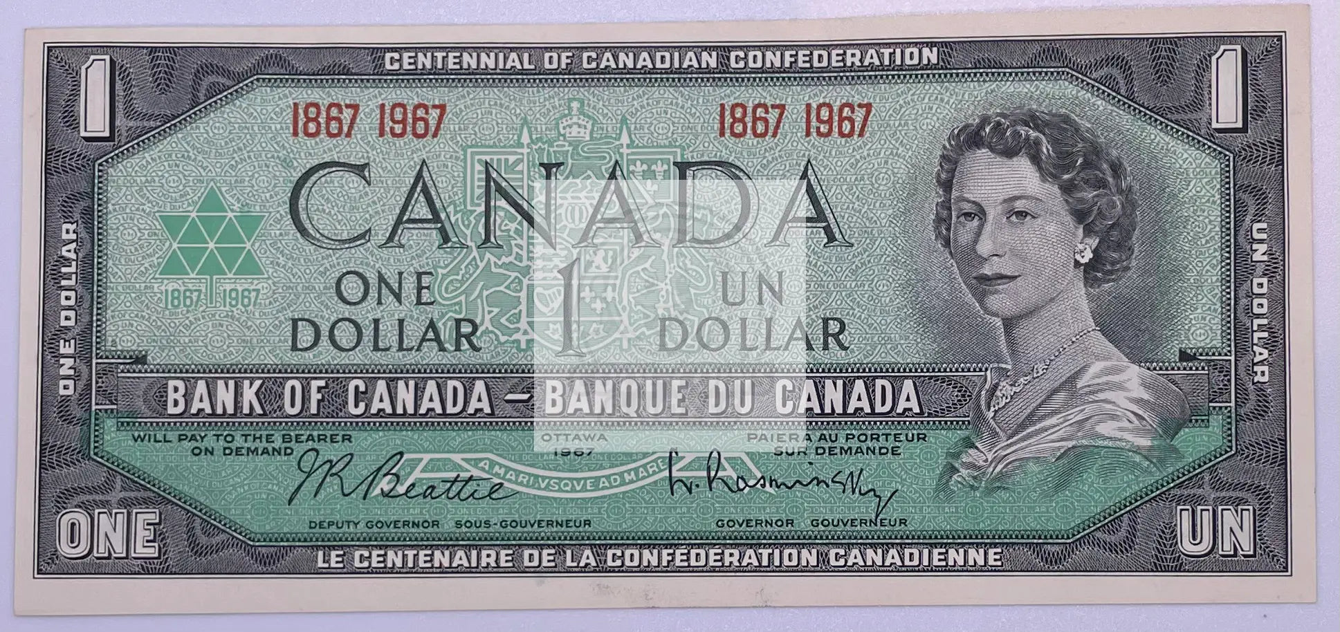 Canada $1 1967 commemorative banknote featuring Queen Elizabeth II in UNC condition