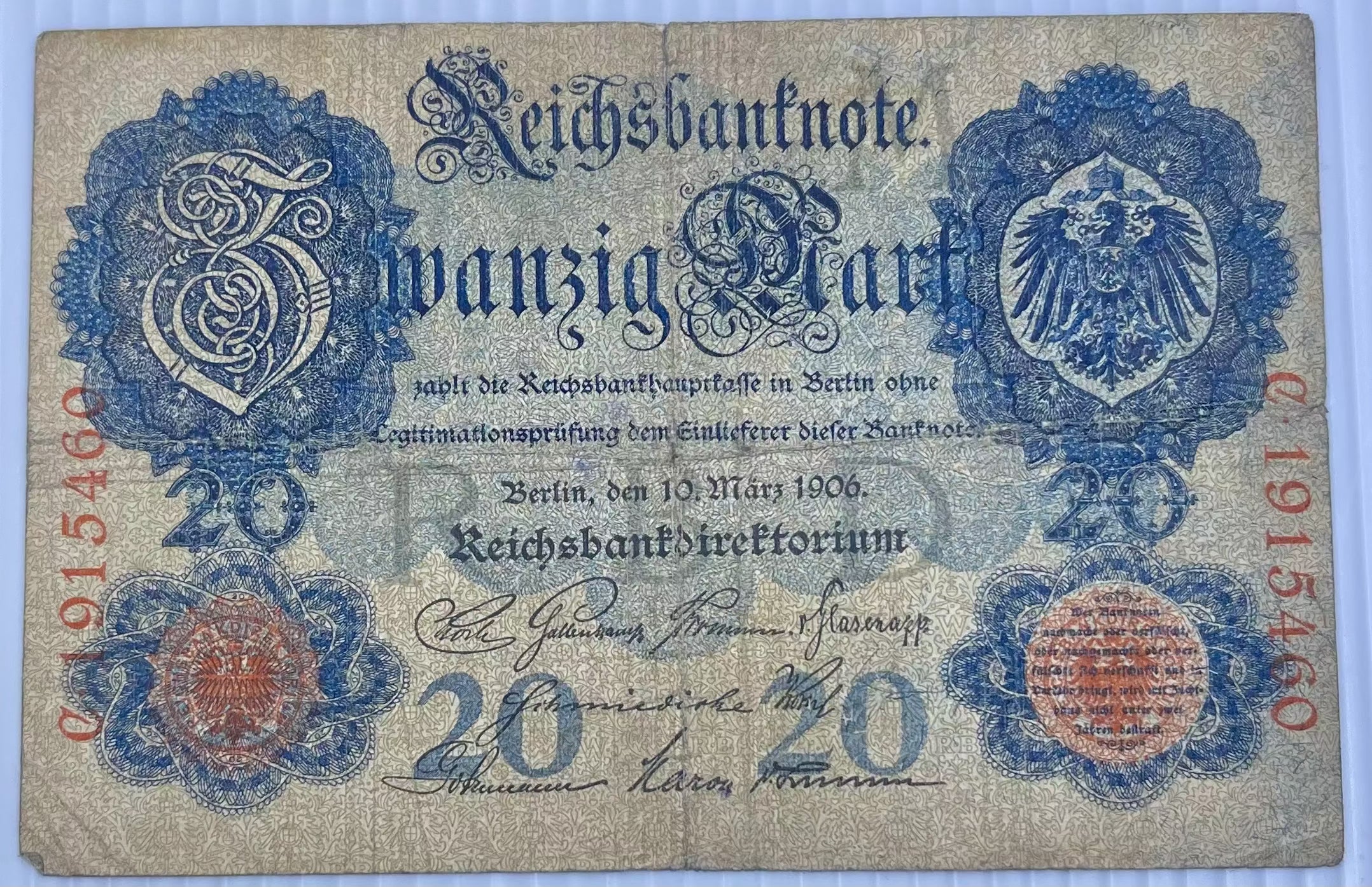 Used Germany 20 Mark banknote from 1914 with intricate engravings and historical design