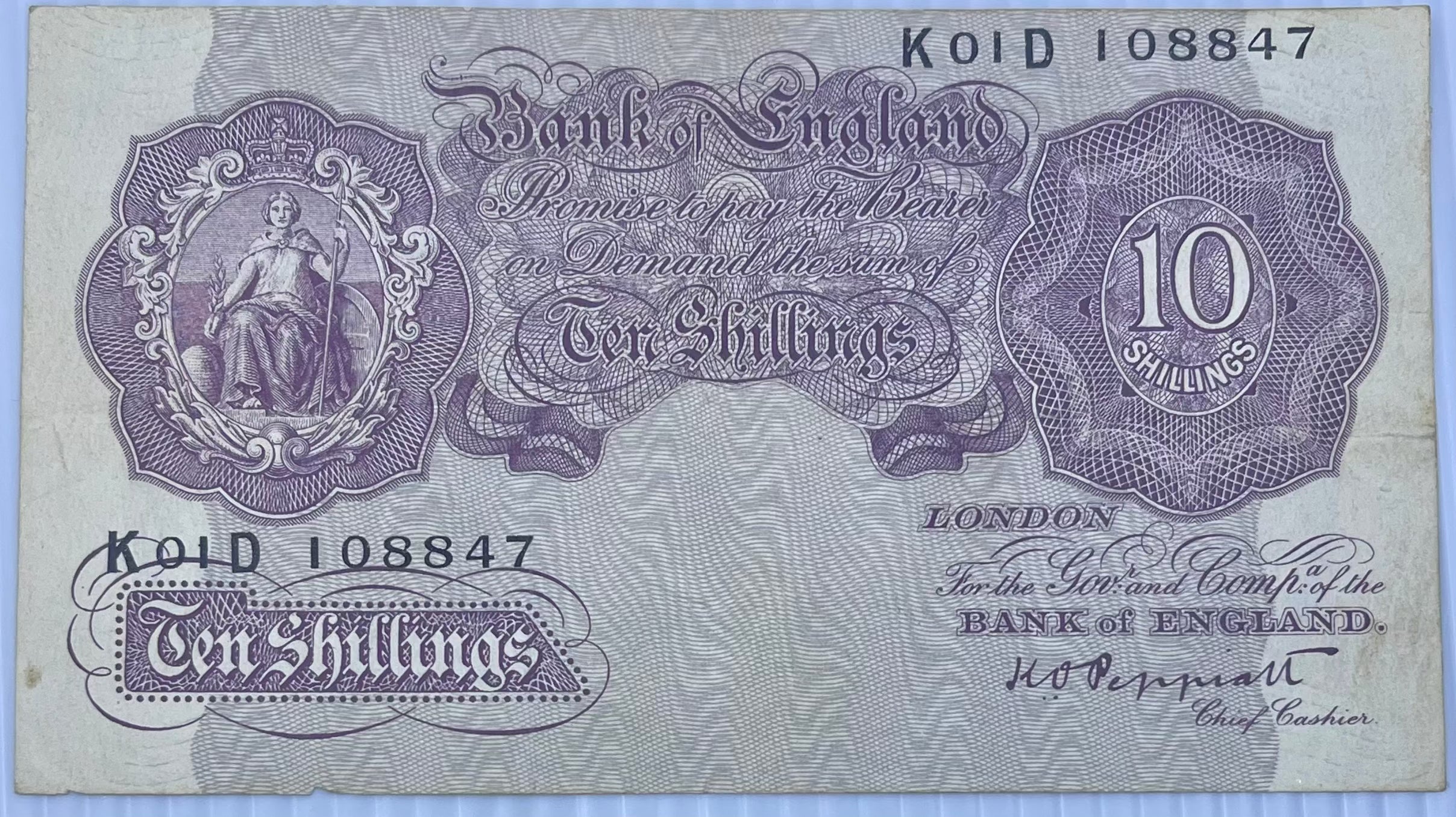 England & Northern Ireland 10 Shilling ND (1940-1962) circulated banknote featuring Britannia portrait and intricate engravings