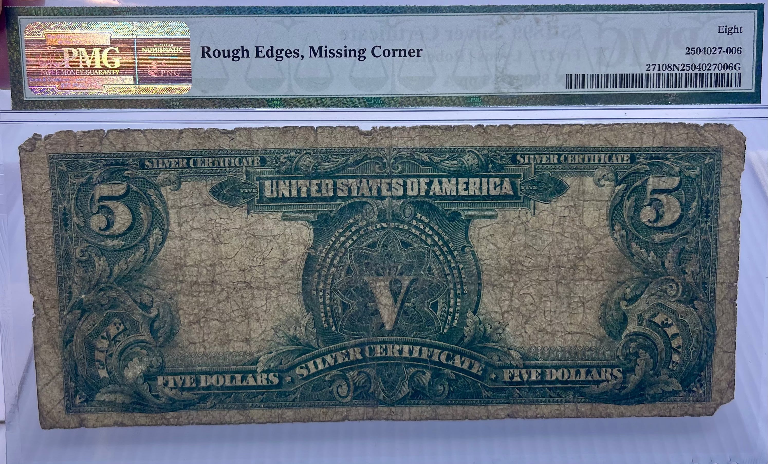 1899 $5 Silver Certificate Chief note with Native American portrait, PMG 8 NET graded, blue Treasury seal, rough edges, missing corner