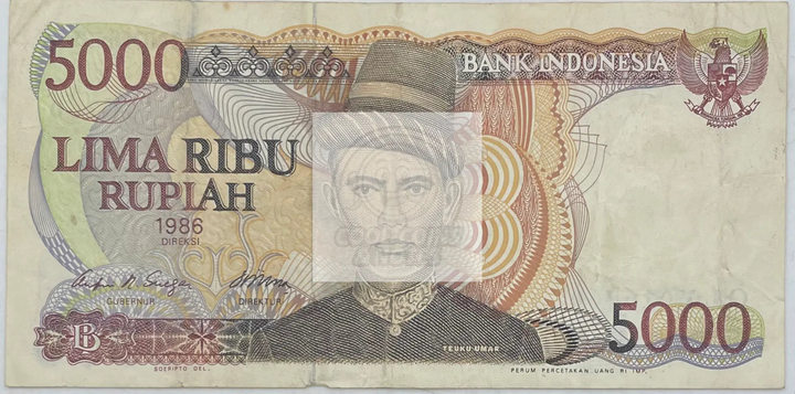 1986 Indonesia 5000 Rupiah banknote P125a featuring cultural and historical Indonesian designs